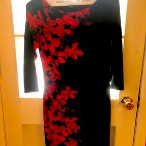 Versatile black dress with red flower burst